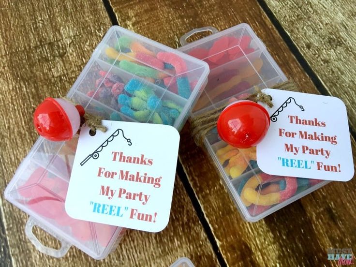 two plastic containers filled with candy and some tags on top of each container that says thanks for making my party reel fun