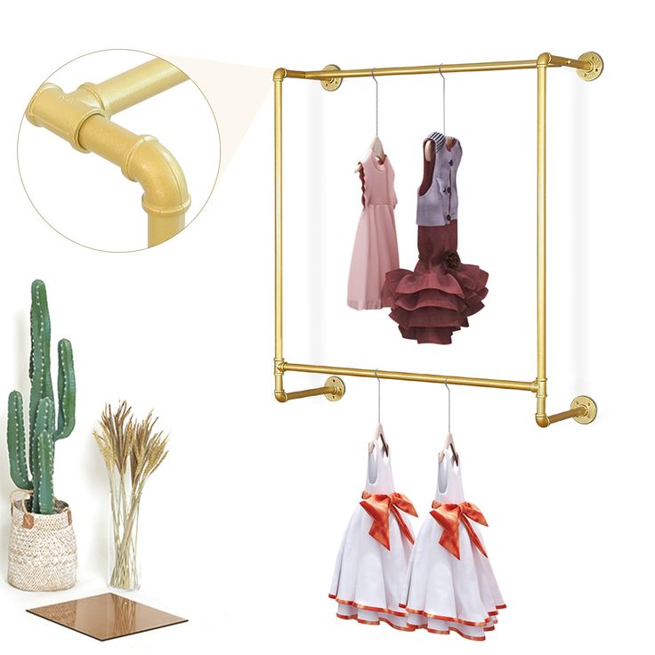 there are three dresses hanging on the clothes rack next to cactus and cacti