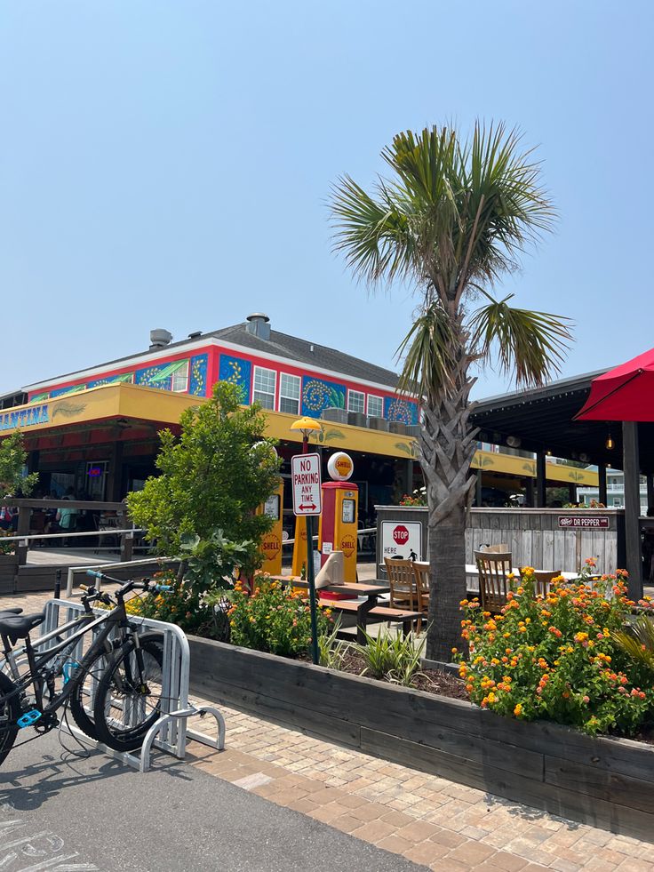 two bicycles parked in front of a restaurant