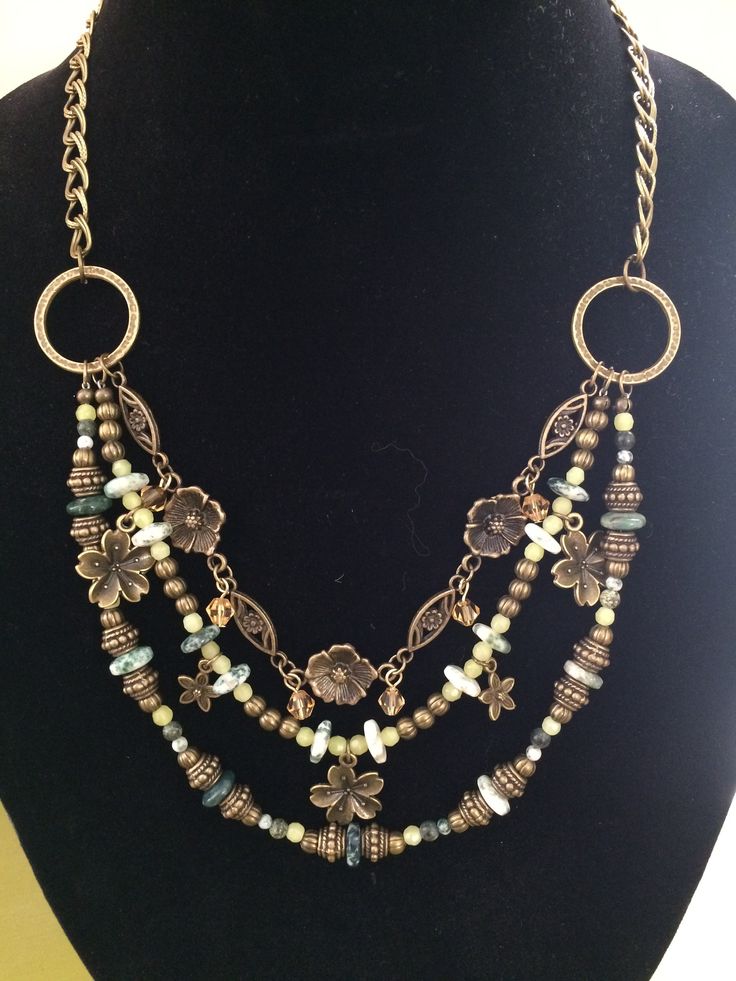 The double chain drops to hammered brass rings, and then 3 strands of beads and brass swoop and dangle appealingly. Easy toggle closure with a pretty brass rose. Very versatile but with a wealth of detail and texture. Bohemian Layered Multi-strand Necklace With Dangling Beads, Bohemian Multi-strand Layered Necklace With Dangling Beads, Bronze Metal Jewelry With Beaded Chain, Bronze Brass Beaded Chain Jewelry, Bronze Brass Jewelry With Beaded Chain, Bronze Brass Jewelry With Dangling Beads, Bohemian Multi-strand Brass Jewelry, Bohemian Multi-strand Layered Necklace With Double Chain, Bohemian Metal Layered Necklace With Beaded Chain