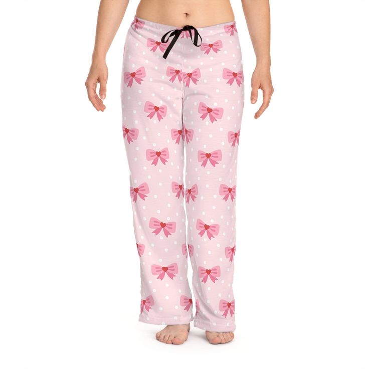 Wrap yourself in the sweet embrace of our Coquette Design Women's Pajama Pants, featuring an adorable pattern of hearts and bows that's sure to enchant. Crafted for comfort and style, these pajama pants boast a relaxed fit, perfect for lounging or drifting off to dreamland. The soft fabric ensures a cozy night's sleep, while the elastic waistband with a drawstring offers an adjustable, snug fit. Whether you're treating yourself or surprising someone special, these pants are the perfect addition Pink Heart Print Bottoms For Loungewear, Casual Heart Print Bottoms For Pajama Party, Playful Pink Pants For Pajama Party, Cute Pink Pants With Elastic Waistband, Cute Pink Bottoms For Sleepover, Playful Pink Bottoms For Pajama Party, Playful Pink Pajama Party Bottoms, Comfy Sleepwear, Coquette Design