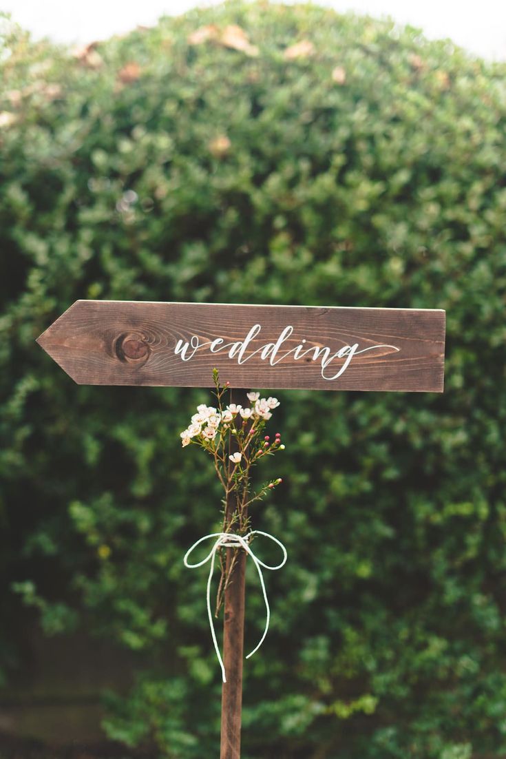 a wooden sign that says wedding on it