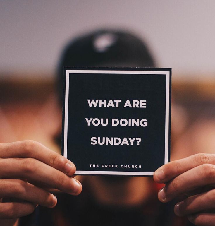 someone holding up a sign that says, what are you doing sunday? the creek church