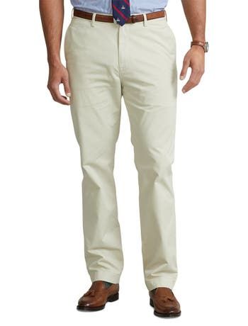 Ultra-soft stretch cotton and a relaxed fit make these chinos from Polo Ralph Lauren a comfortable classic you’ll wear again and again. _x000D_ 97% cotton/3% elastane Flat-front style Zip fly with a buttoned closure Belt loops Side pockets, right hip coin pocket, back left buttoned pocket, back right button-and-loop pocket Signature embroidered Pony above the back right pocket Size 46W has a 12½" rise and a 19½" leg opening Due to the natural characteristics of this material, the coloring may ru Spring Straight Fit Cotton Chinos, Spring Cotton Chinos With Straight Fit, Spring Cotton Straight Fit Chinos, Casual Cotton Pants For Business Casual, Solid Cotton Straight Dress Pants, Casual Slim Fit Chinos In Chino Cotton Twill, Casual Business Chino Cotton Twill Dress Pants, Casual Chino Cotton Twill Straight Dress Pants, Casual Straight Chino Cotton Twill Chinos