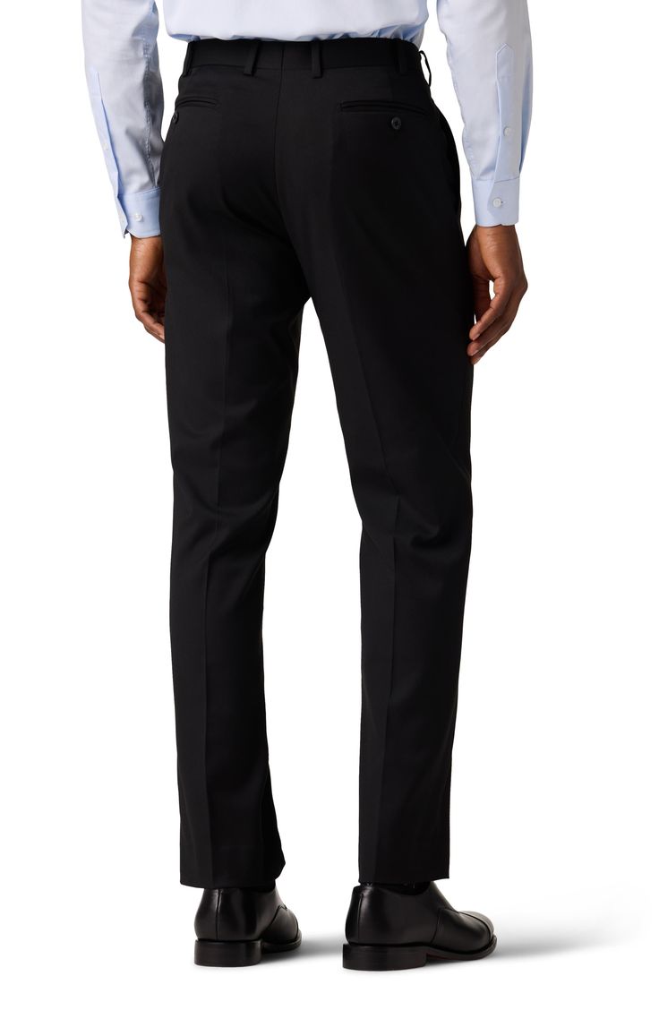 Dress to impress in these polished and practical trousers tailored from wrinkle-resistant performance fabric. 32" inseam; 15.75" leg opening; 10.125" rise (size 32x32) Zip fly with hook-and-bar closure Jetted pockets Lined Polyester/rayon blend with 2% spandex
 Dry clean Imported Fitted Solid Color Dress Pants For Semi-formal Occasions, Slim Fit Business Trousers, Business Slim Fit Trousers, Tapered Leg Bottoms With Concealed Placket For Business Casual, Slim Fit Full Length Business Casual Pants, Slim Fit Full Length Pants For Business Casual, Slim Fit Full Length Dress Pants For Semi-formal Occasions, Fitted Trousers For Business Casual, Solid Color Slim Fit Straight Leg Dress Pants