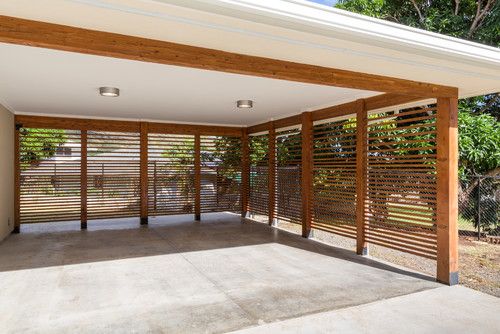 an empty garage with wooden slats on the walls