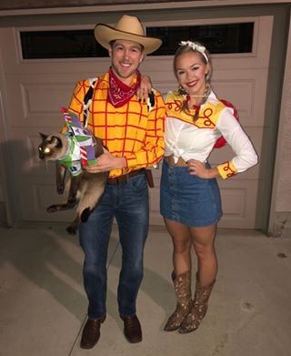 a man and woman in costumes standing next to each other