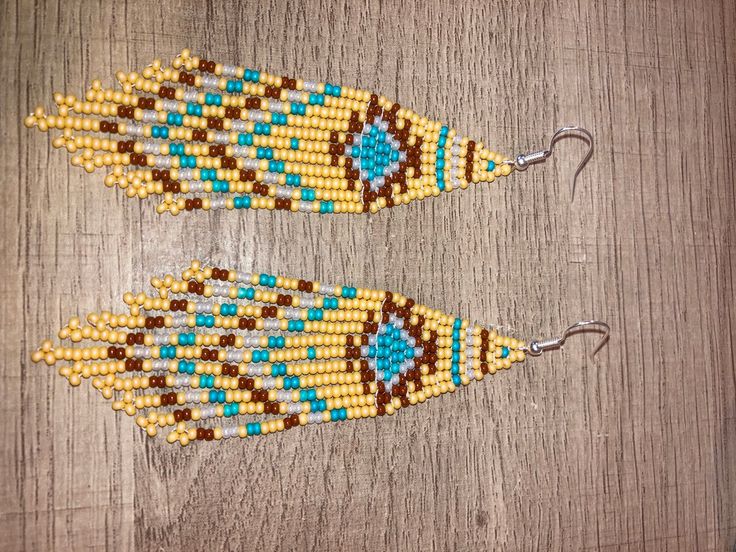 Yellow Bohemian Tassel Earrings For Beach, Handmade Tassel Earrings For Festivals, Handmade Bohemian Tassel Earrings For Festivals, Handmade Unique Tassel Earrings For Festivals, Southwestern Fringe Dangle Earrings, Bohemian Chandelier Earrings With Fringe And Round Beads, Bohemian Latkans Earrings For Beach, Festival Fringe Earrings With Round Beads, Turquoise Handmade Tassel Earrings For Festivals