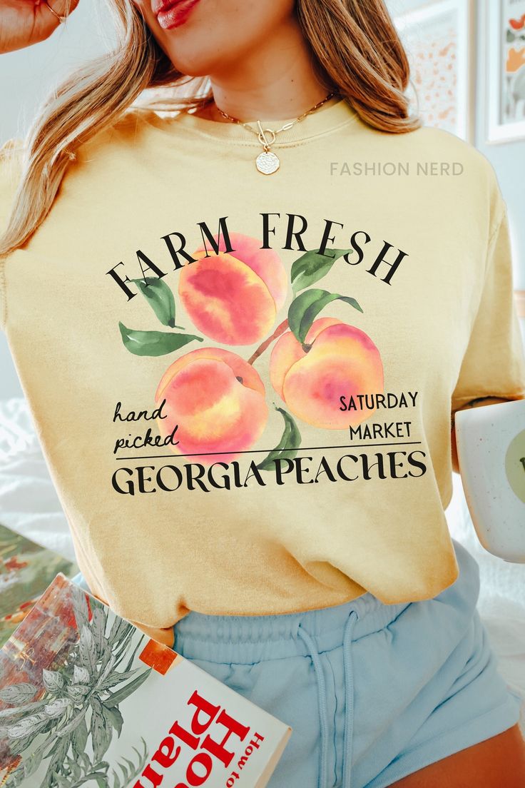 Dive into summer with farm-fresh georgia peaches, indulge in the softness of a Comfort Colors t-shirt. Whether paired with shorts for a beach day or dressed up with a skirt for a sunset soirée, this summer staple exudes both comfort and farmcore flair. 𝔻𝔼𝕋𝔸𝕀𝕃𝕊 Comfort Colors 1717 T-Shirt 💗Fabric content: 100% Cotton 💗Feel: luxe thick garment-dyed cotton 💗Fit: oversized unisex fit - Models are wearing XL Gildan 5000 T-Shirt 💗Fabric content: 100% Cotton; heathered colors have added polyester 💗Feel: tubular jersey knit cotton 💗Fit: standard unisex fit - Models are wearing L ➡️Direct to Garment Printing uses ink jet technology to spray ink onto garments for a strong bond between the ink and fibers. ➡️Kindly note that colors, contrast, textures and positions of graphics can slightl Peach Cotton Tops For Brunch, Summer Peach T-shirt With Graphic Print, Summer Brunch Cotton T-shirt, Spring Brunch Cotton T-shirt, Summer Cotton T-shirt For Brunch, Spring Cotton T-shirt For Brunch, Cotton T-shirt For Summer Brunch, Trendy Heather Peach T-shirt For Summer, Casual Heather Peach T-shirt For Summer