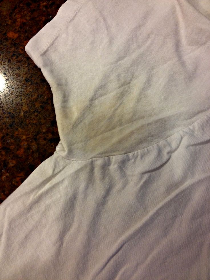 a white shirt laying on top of a table