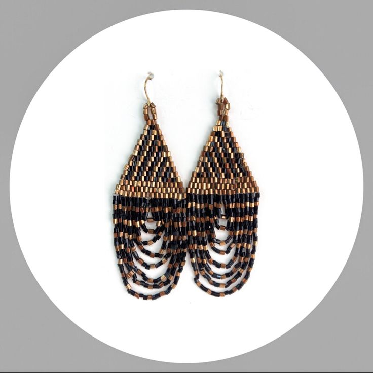 a pair of black and brown beaded earrings