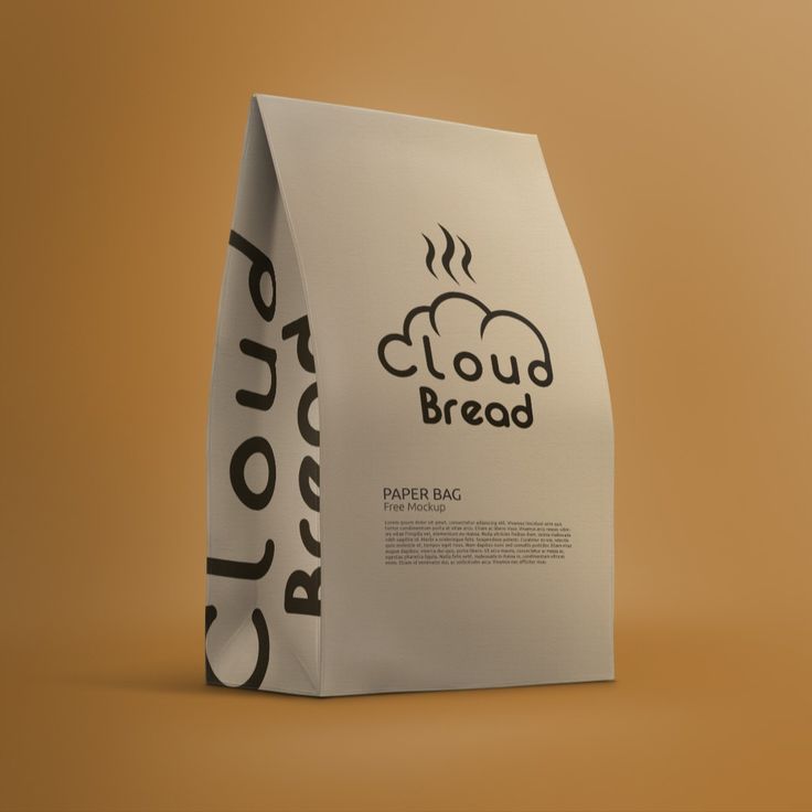 a paper bag with the word cloud bread printed on it, sitting against a brown background