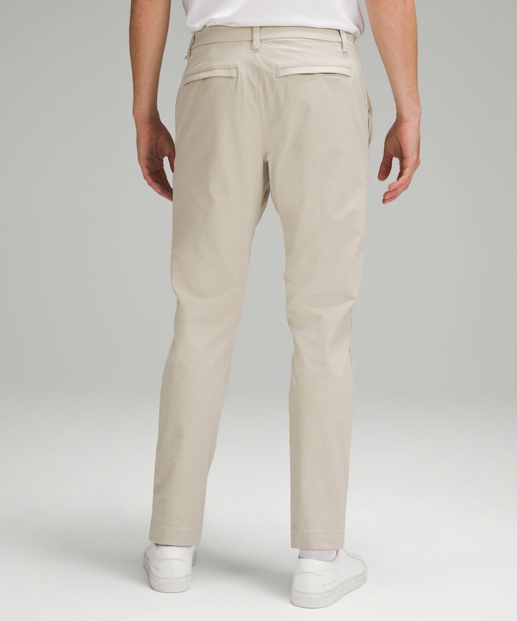 Welcome to the all-day comfort club. Previously known as the Commission Pant, we've removed the back-knee seam from these trousers for a more elevated look. Designed for Casual. You asked, we listened. Based on guest feedback, this slim fit still skims your leg from hip to hem, but now has a roomier feel in the glutes and thighs:Our ABC technology uses an ergonomic gusset to remove tension from the crotch of our pants. Discreet zippered pocket on side seam. Back welt pockets with hidden snaps. F Everyday Lululemon Pants With Pockets, Lululemon Bottoms With Side Pockets For Everyday, Lululemon Cotton Bottoms For Everyday, Lululemon Everyday Bottoms With Side Pockets, Lululemon Straight Leg Bottoms With Hip Pockets, Lululemon Straight Leg Bottoms With 4-way Stretch, Lululemon Tapered Leg Pants With Hip Pockets, Lululemon Stretch Workwear Bottoms, Lululemon 4-way Stretch Bottoms With Pockets