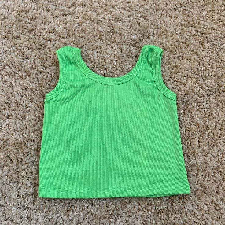 Stretchy Material Never Worn Great Condition Fits Xsmall- Medium Very Small Armpit Holes Models Measurements: 27 Waist, 34 B, Wears Shirts: Small/ Medium Basic Green Tank Top, Basic Green Tank Top For Spring, Basic Green Tank Top For Summer, Green Basic Tank Top For Summer, Fitted Green Cotton Tank Top, Plain Green Top For Summer, Basic Green Sleeveless Crop Top, Green Sleeveless Basic Crop Top, Red Trench Coat