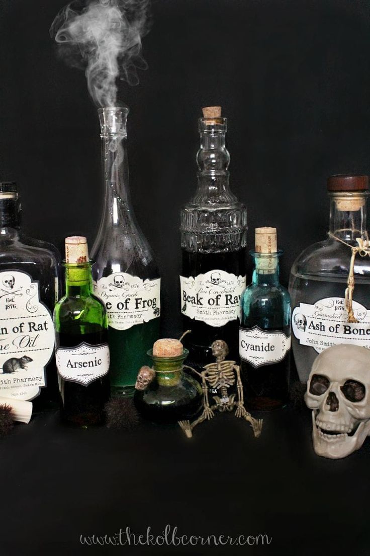 there are many bottles that have different types of alcohol in them, including one with a skull on it