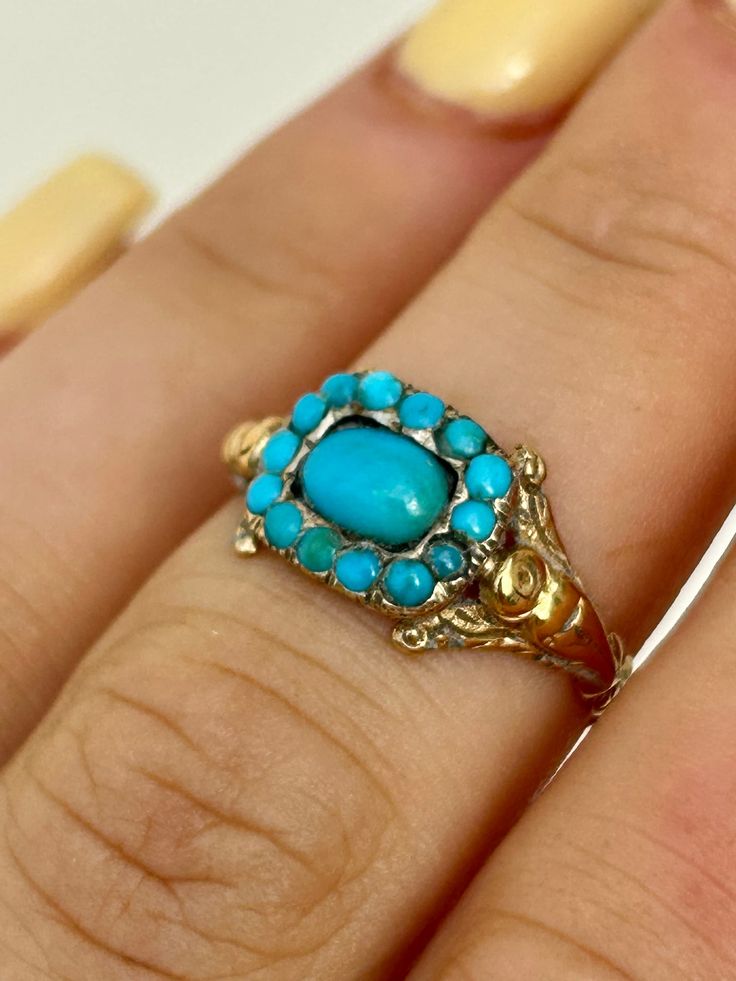 Antique Turquoise Gold Ring  gorgeous engraved shoulders, wonderful turquoise stones The item comes without the box in the photos but will be presented in a gembank1973 gift box   Measurements: Weight 1.94g, size UK M / US 61/2, head of ring 10mm x 8mm, height off finger 2mm  Materials: gold and turquoise  Hallmarks: none present    Condition : The overall condition is very good office use: DC2 Antique Oval Turquoise Ring Hallmarked, Antique Turquoise Gemstone Ring For Formal Occasions, Vintage Yellow Gold Turquoise Ring Hallmarked, Antique Turquoise Ring In Yellow Gold, Antique Oval Turquoise Ring, Vintage Yellow Gold Turquoise Cabochon Ring, Antique Oval Turquoise Ring For Wedding, Antique Yellow Gold Turquoise Ring For Anniversary, Vintage Turquoise Ring For Wedding