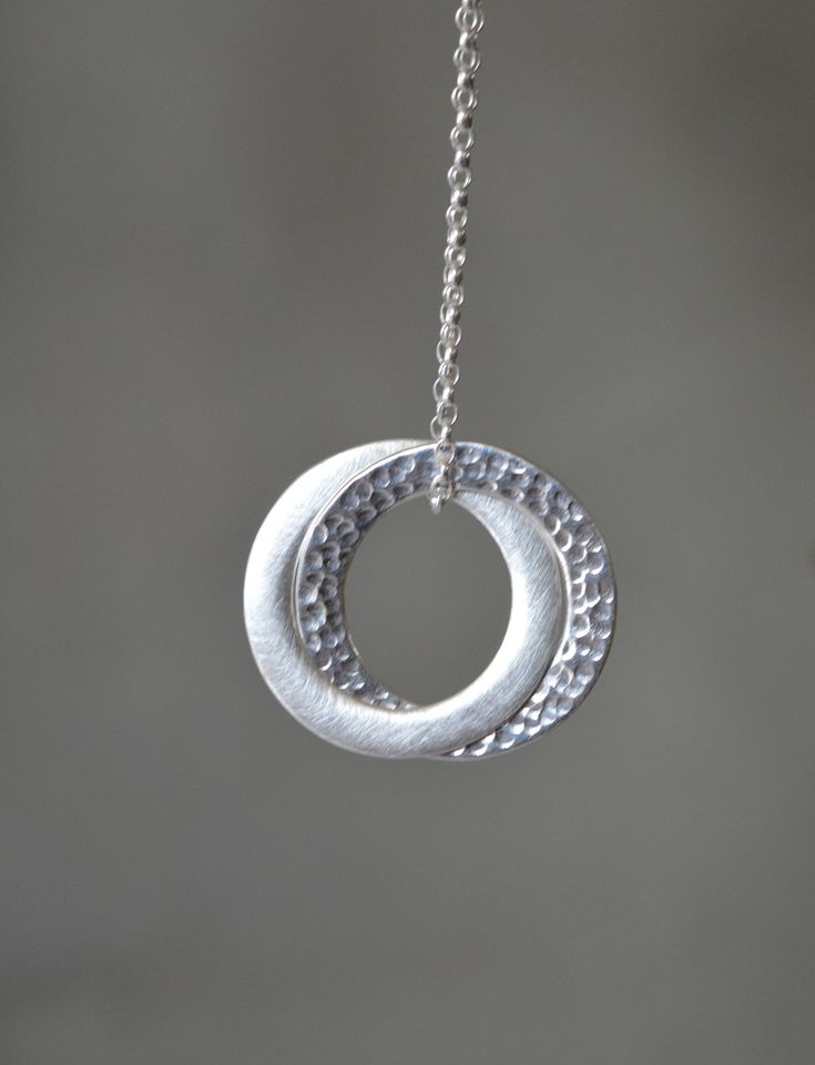 "Stylish and timeless sterling silver interlocking circle pendant. One ring has been hammered for a beautiful texture, and the other has been given a satin finish. The pendant hangs on a sterling silver belcher chain. Circles are approximately 2.5 cm (0.9\") in diameter The necklace will come in a beautiful gift box. * CHECK OUT MORE JEWELLERY * www.etsy.com/shop/kailajewellery" Precious Metal Clay Jewelry, Interlocking Circle Necklace, Necklace Friendship, Infinity Pendant, Metal Clay Jewelry, Precious Metal Clay, Circle Pendant Necklace, Silver Work, Circle Necklace