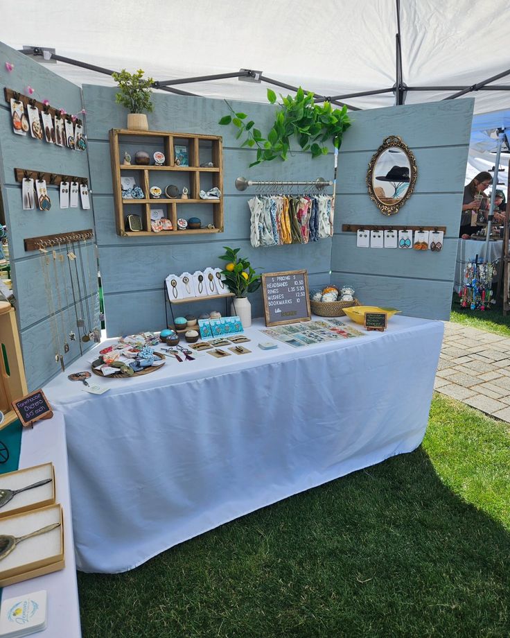 a table that has some items on it and is set up for an outdoor event