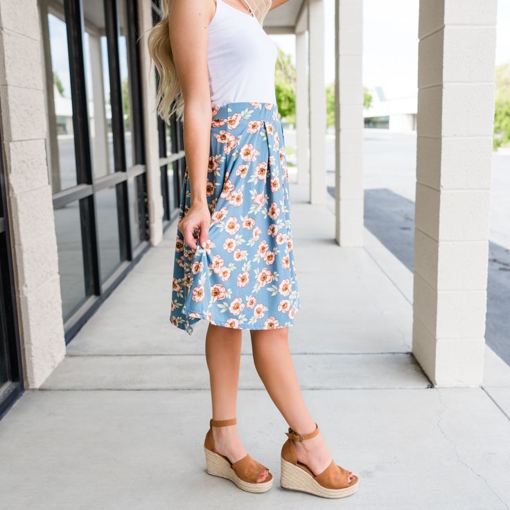 How adorable is this skirt?! It features an adorable fun floral print throughout, soft material your skin will love, and an elastic waistband. Offering comfort all while looking and feeling fabulous. Made in the USA! Sizes: Small 0-4 Medium 6-8 Large 10-12 Description: Model is 5'6'' wearing size small Runs Small (Order Size Up) Floral Print Flared Skirt Bottoms For Summer, Floral Print Flowy Skirt, Knee-length Floral Print Bottoms For Spring, Floral Print Flowy Skirt For Day Out, Knee-length Floral Print Spring Bottoms, Floral Print Skirted Bottoms For Beach, Beach Skirted Bottoms With Floral Print, Floral Print Knee-length Bottoms For Beach, Floral Print Summer Skirt