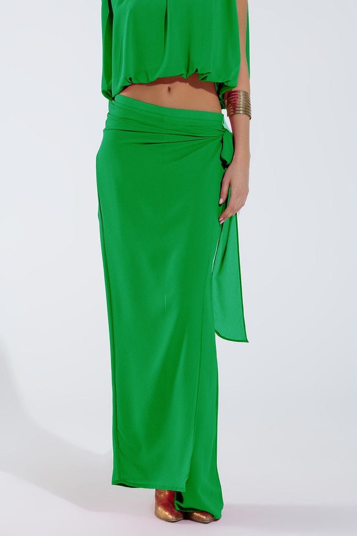 Introducing our Wide Green Pants Overlay Skirt, a stunning and versatile piece perfect for adding a touch of elegance to your party attire. This maxi-length overlay skirt features wide legs and a relaxed fit, providing both comfort and sophistication for any occasion.  Crafted from lightweight chiffon fabric, this overlay skirt drapes beautifully and flows with every movement. The knot detail at the side adds a chic and stylish touch, while the zip side closure ensures easy wear.  Perfect for parties or special events, this skirt can be paired with a variety of tops to create different looks. Made from 100% polyester with a polyester lining, it is durable and easy to care for, making it a practical choice for your wardrobe.  Our model is wearing size S, but the S-M-L sizing corresponds to Chiffon Pants, Skirt Draping, Overlay Skirt, Party Attire, Style Party, Scarf Headband, Chic Top, Trouser Pants Women, Green Pants