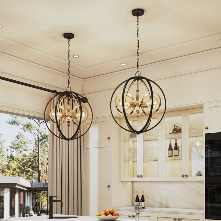 two chandeliers hanging from the ceiling in a kitchen