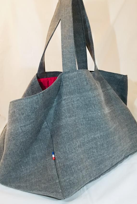 XLARGE TOTE BAG Gray Cotton  Linen Blend Large Tote Woman Travel Bag Oversize bagOutside:Cotton (choice of colors, ask me for details)2 large shoulder strapsInside:Cotton lining (colors and patterns may vary)1 zipper pocket3 slip in pockets1 key leashApprox. Size: (custom)One on picture is :Length of bottom: 20in (50 cm)Width of Bottom: 12 in (30 cm )Height: 15 ²³⁄₆₄ in (39 cm)Similar item:https://www.etsy.com/fr/listing/521031368/big-pink-tote-xl-beach-bag-cotton?ref=shop_home_active_39&frs=110 Gray Large Capacity Bags For Shopping, Large Square Shoulder Bag For Travel, Trendy Travel Bag With Rolled Handles, Gray Tote Bag For Shopping, Gray Large Capacity Softback Bag, Large Capacity Gray Tote Shoulder Bag, Large Rectangular Hobo Bag For Travel, Daily Use Tote Beach Bag With Pockets, Daily Use Canvas Shoulder Bag With Rolled Handles