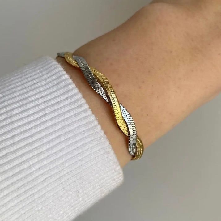 Our Eleanor Watchband Bracelet adds a trendy and timeless touch to any outfit. The perfect accessory for those looking to exude girl boss vibes. Made with high-quality materials for durability and style. Elevate your look and make a statement with this must-have piece. 316L Stainless Steel 18K PVD Gold Plated 6.5 inches long +2" inches ext/ 7mm wide Elegant Stainless Steel Braided Bracelets, Trendy Metal Bracelets Tarnish Resistant, Trendy Metal Bracelets With Tarnish Resistance, Trendy Metal Bangle For Everyday, Trendy Metal Bangle For Formal Occasions, Elegant Stainless Steel Braided Bracelet, Everyday Stainless Steel Braided Bracelet, Trendy Gold Bangle Bracelet For Formal Occasions, Trendy Silver Braided Metal Bracelet