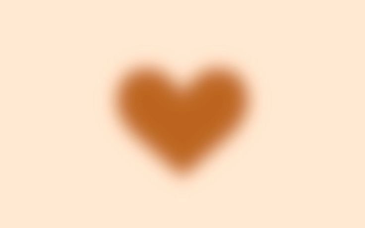 a heart shaped shadow on a beige background