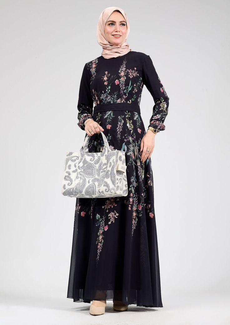 Discover timeless elegance with our Sophia Floral Print Chiffon Long Sleeve Maxi Dress, designed to elevate your modest fashion collection. Crafted from lightweight chiffon, this dress is fully lined with soft polymix fabric for ultimate comfort and ease of movement. The striking floral print adds a touch of feminine charm, while the full-length silhouette and long sleeves provide modest coverage, perfect for various occasions. This dress combines modesty with grace, featuring a fitted waistband Elegant Embroidered Georgette Maxi Dress, Elegant Silk Chiffon Maxi Dress With Floral Print, Elegant Silk Chiffon Floral Maxi Dress, Chic Long Sleeve Georgette Maxi Dress, Feminine Georgette Maxi Dresses, Flowy Georgette Maxi Dress Feminine Style, Black Floral Print Maxi Chiffon Dress, Flowy Feminine Georgette Maxi Dress, Elegant Black Georgette Maxi Dress