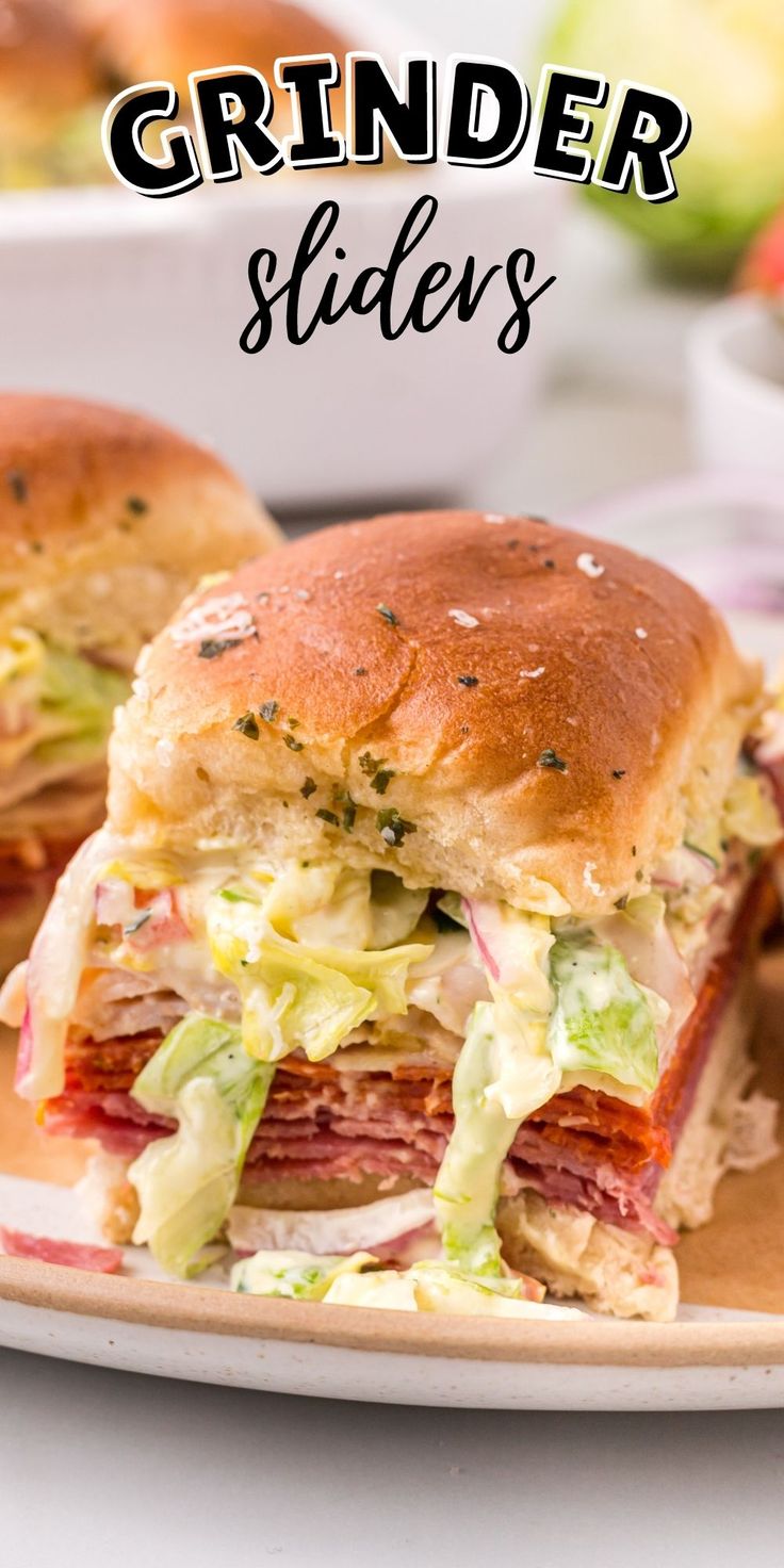 a close up of a sandwich on a plate with the words grinder slides above it