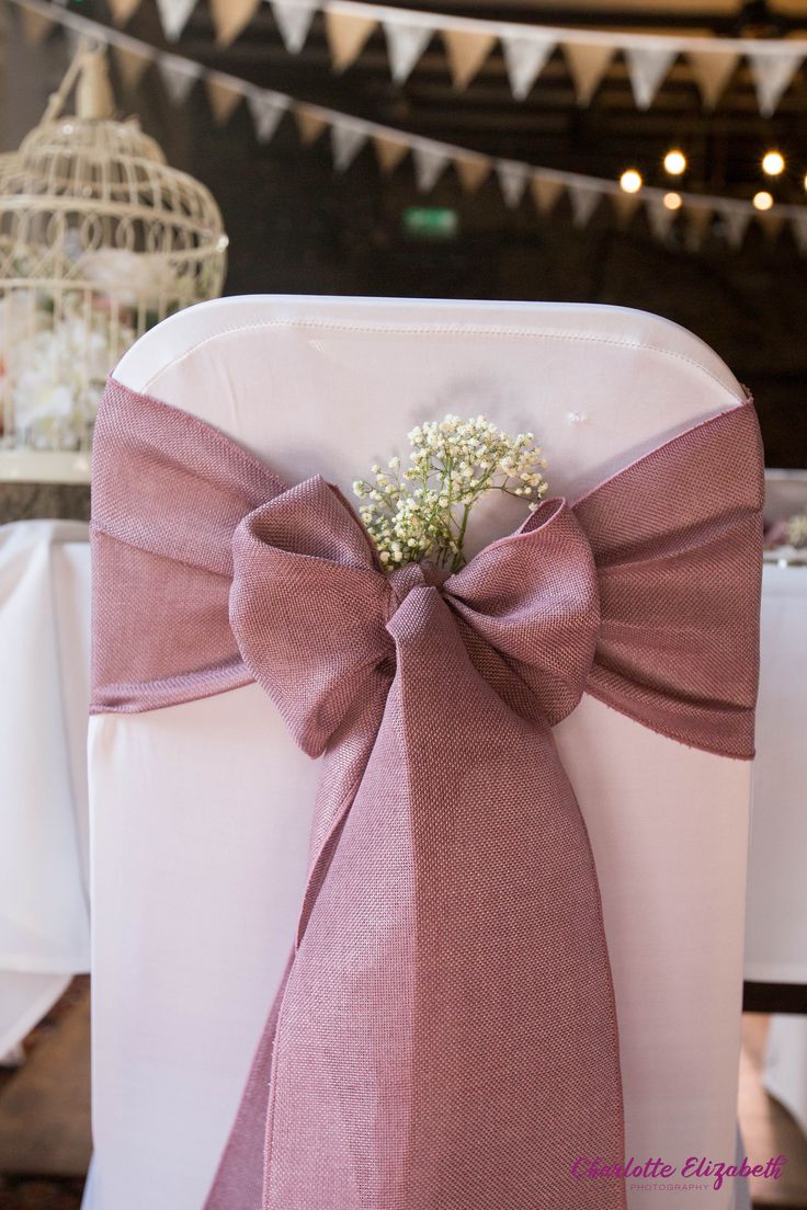 Dusky pink fabric bow at a rustic springtime wedding Bows For Wedding Decorations, Bows On Chairs Wedding, Chair Bows Wedding, Spring Wedding Theme, Hessian Wedding, Bow Chair, Wedding Ceremony Decorations Indoor, Wedding In Spring, Cook Shrimp