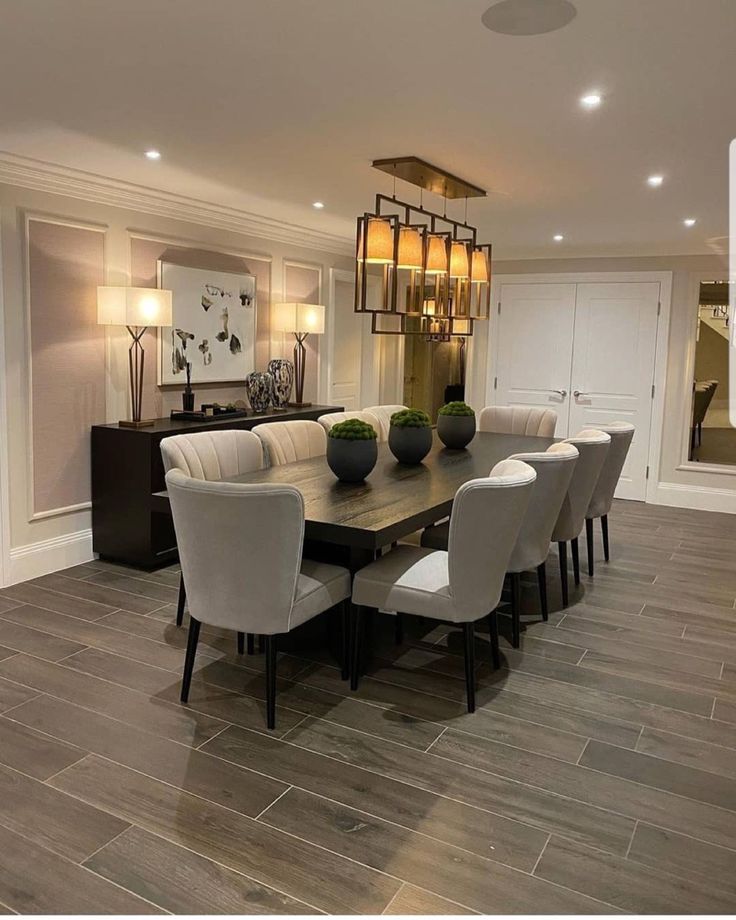 a large dining room table with white chairs