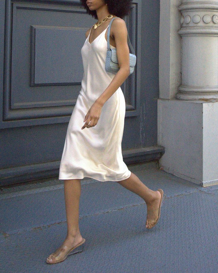 Price Comparison Few Moda $79 Reformation $248 Faithfull the Brand $340 Product Details Introducing the Aldina Silk Dress. With adjustable straps and a V-neck, this simple slip dress offers ultimate comfort and elegance. Made from 100% premium silk, it boasts a silky smooth feel. Perfect for any occasion with its midi length. - Adjustable straps- Lined- Content: Fabric: 100% Silk, Lining: 100% Polyester Style# T24WDRD1090G Fit Notes - Model wearing a size S - Model measurements: 5'10'' Height / Satin Slip Dress With Cowboy Boots, White Camisole Dress, Satin Dress Sneakers Outfit, White Silk Dress Outfit, Slip Dress With Belt, White Slip Dress Outfit, Silk Dress Aesthetic, Slip Dress Aesthetic, Simple Slip Dress