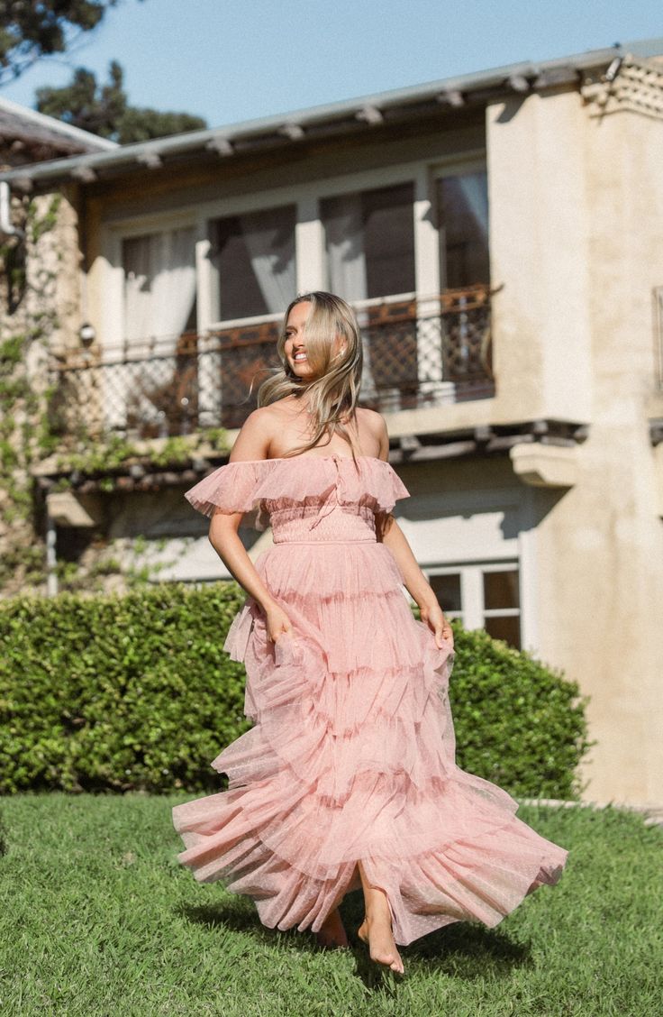 A romantic Swiss-dot tulle maxi dress awash in dreamy ruffles features a dainty keyhole tie, fluttery sleeves and cascading tiers. Slips on over head Square neck Cap sleeves Lined 100% nylon Hand wash, dry flat Imported Feminine Ruffled Maxi Dress For Prom Season, Spring Tulle Maxi Dress With Ruffles, Spring Tulle Maxi Dress For Wedding Guest, Pink Tulle Maxi Dress For Summer, Spring Tulle Maxi Dress For Garden Party, Spring Garden Party Maxi Dress In Tulle, Spring Garden Party Tulle Maxi Dress, Ruffle Tulle Skirt, Glitter Prom Dresses