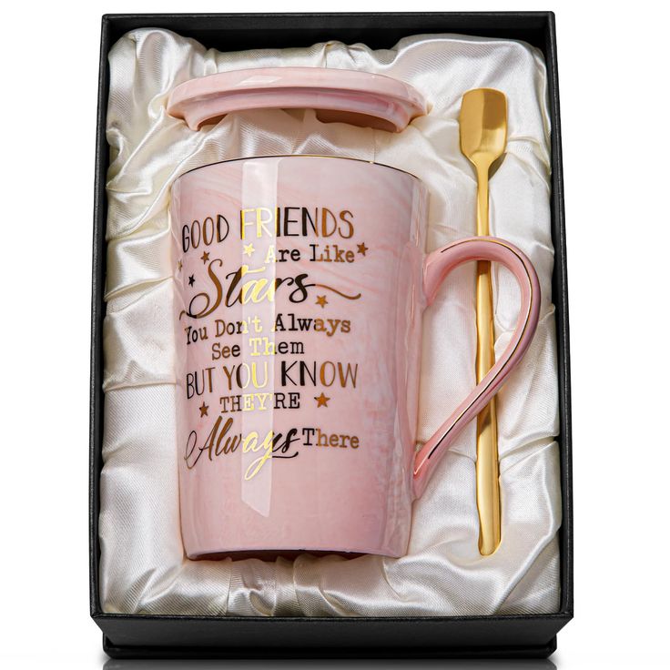 a pink coffee mug and spoon in a gift box with the words good friends are like stars