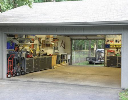 an open garage door with tools in it