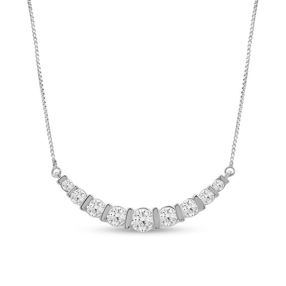 Layer charming sparkle into your favorite looks with this lab-created diamond nine-stone necklace. 14K white gold Nine channel-set round certified lab-created diamonds graduate in size to the largest 1/4 ct. center stone This curved design suspends centered along a box chain F color/SI2 clarity with certification card 1 ct. t.w. of lab-created diamonds 16.0- to 18.0-inch adjustable necklace; spring-ring clasp Channel Set Diamond Necklace, Curve Design, Channel Set, Adjustable Necklace, Lab Created Diamonds, Box Chain, Stone Necklace, Spring Rings, A Box