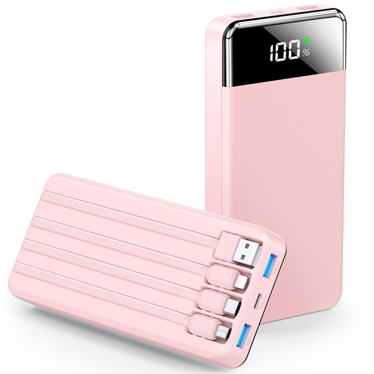 a pink power bank sitting next to an external charger with four usbs attached