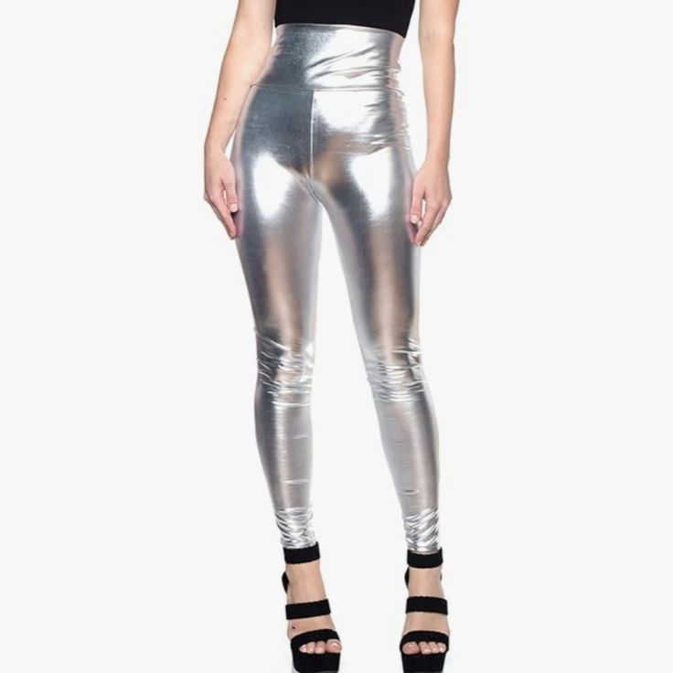 92% Polyester 8% Spandex Leather Look Like Coated Fabric; Extra Wide High Waistband; Slim Fit; Full Length; No Closure Hand Wash Cold; Do Not Bleach; Line Dry In Shade; Low Heat Iron Measurements Approx Flat Waist 11 Inches Inseam 28 Inches Sleek Stretch Metallic Leggings, Sleek Metallic Stretch Leggings, Metallic Stretch Full-length Leggings, Metallic Stretch Full Length Leggings, Metallic Full Length Stretch Leggings, Metallic Stretch Bottoms For Night Out, Trendy Metallic Leggings For Night Out, Sleek Fitted Metallic Bottoms, High Stretch Leggings For Fall Party