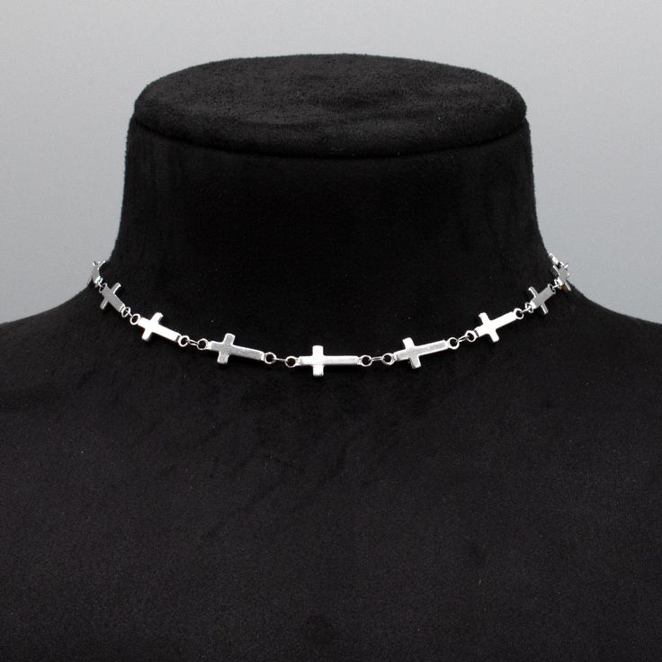 Cross (Crucifix) Link Chain. A stunning minimalist stainless steel choker, perfect for layering. 18mm x 8mm Width Stainless Gothic Cross Link Chain 4 Inch 4.7mm Stainless Steel Adjuster Chain Hand Made in the UK Sizing: Small 11 - 15 Inches (28cm - 38cm) Medium 13 - 17 Inches (33cm - 43cm) Large 15 - 19 Inches (38cm - 48.5cm) Stainless Steel Clavicle Chain Choker Gift, Adjustable Stainless Steel Choker With Clavicle Chain, Adjustable Stainless Steel Clavicle Chain Choker, Silver Stainless Steel Choker With Clavicle Chain, Silver Minimalist Cross Necklace With Clavicle Chain, Silver Stainless Steel Choker With Adjustable Chain, Adjustable Silver Stainless Steel Choker, Minimalist Stainless Steel Cross Necklace With Adjustable Chain, Minimalist Silver Stainless Steel Cross Necklace