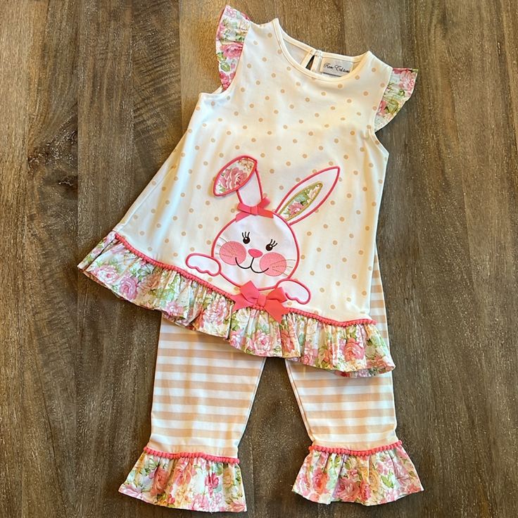 Rare Editions 2-Piece Bunny Outfit. Color Oatmeal With Tan Polka Dots/Stripes And Pink Floral. Sleeveless Top Has A Beautiful Bunny Appliqu/Gold Thread On Front And Buttons To Back. Pink Pompom Edging. Pull-On Pant. 58% Cotton, 38% Polyester And 4% Spandex. Ruffles 100% Cotton. Purchased At Dillards Size 6. New With Tags. Playful Playwear Sets For Spring, Playful Spring Playwear Sets, Playful Matching Sets For Spring, Playful Spring Matching Sets, Playful White Sets For Spring, Cute Fitted Easter Sets, Playful Pink Spring Sets, Playful Cotton Sets For Easter, Cute Cotton Sets For Easter