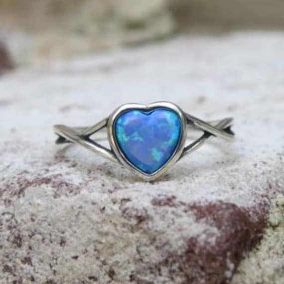 Vintage Sterling Silver Heart Blue Opal Ring ...Marked 925...Total of weights 1.2grams..Size 8...Measure of Face 7.2MM...It's in very good condition. Blue Sterling Silver Opal Promise Ring, Blue Sterling Silver Heart Ring For Anniversary, Blue Jewelry For Valentine's Day Promise, Blue Round Heart Ring As Gift, Blue Heart Cut Promise Ring, Blue Opal Ring Stamped 925 For Gift, Blue Heart Shaped Rings For Anniversary, Blue Birthstone Heart Promise Ring, Blue Sterling Silver Promise Heart Ring