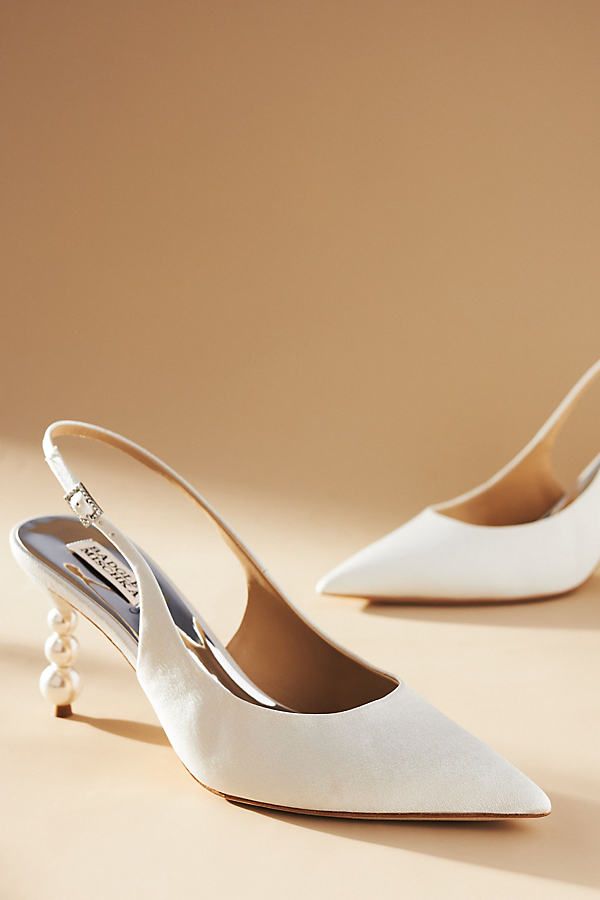 The Badgley Mischka Beatrix Slingback Pumps, adorned with an eye-catching stacked bubble heel, are ready to carry you through your special day in elegant style. | Beatrix Slingback Pumps by Badgley Mischka in White, Women's, Size: 7, Leather/Plastic/Wood at Anthropologie Classic Wedding Shoes, Fall Wedding Shoes, Bride Heels, Elegant Wedding Shoes, White Bridal Shoes, Bridal Pumps, Ivory Wedding Shoes, Wedding Shoes Bride, White High Heels