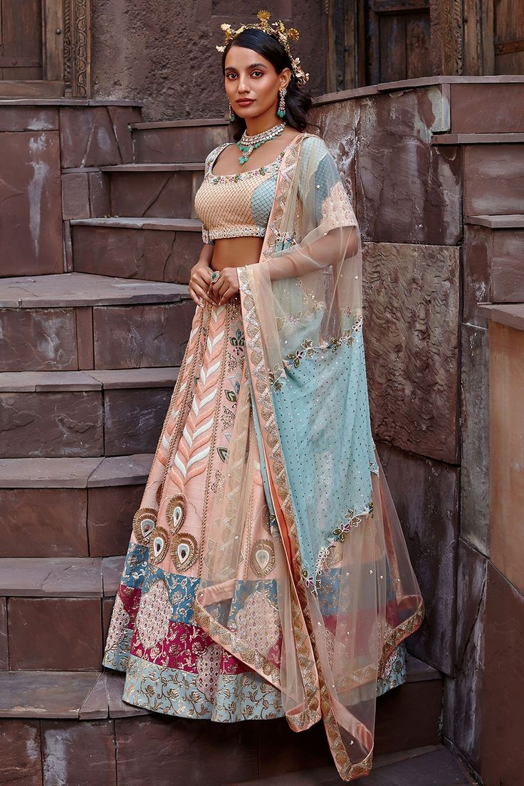 Peach blossom lehenga with zardozi embroidery, bead work and brocade trims at the hem. Comes with blouse and dupatta.
Component: 3
Pattern: Embroidery
Type Of Work: Zardozi and Beads
Neckline: Square
Sleeve Type: Half
Fabric: Pure Raw Silk, Georgette and Chinon Chiffon 
Color: Peach
Other Details: 
Dual tone dupatta with embroidery
Back cutout
Occasion: Wedding - Aza Fashions Semi-stitched Multicolor Lehenga With Sheer Dupatta, Wedding Lehenga With Multicolor Embroidery And Sheer Dupatta, Reception Meenakari Dola Silk Choli, Meenakari Saree Set For Reception, Traditional Drape Meenakari Choli For Reception, Reception Meenakari Kundan Choli, Reception Kundan Meenakari Choli, Bollywood Style Meenakari Lehenga For Reception, Bollywood Meenakari Lehenga For Reception