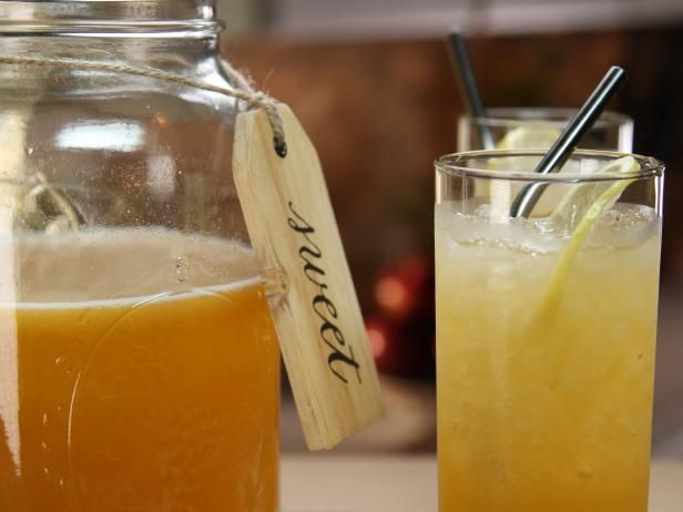 two glasses filled with liquid sitting next to each other