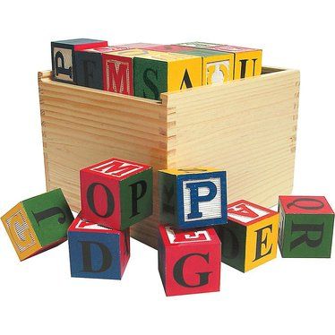 wooden blocks with letters spelling the word pop