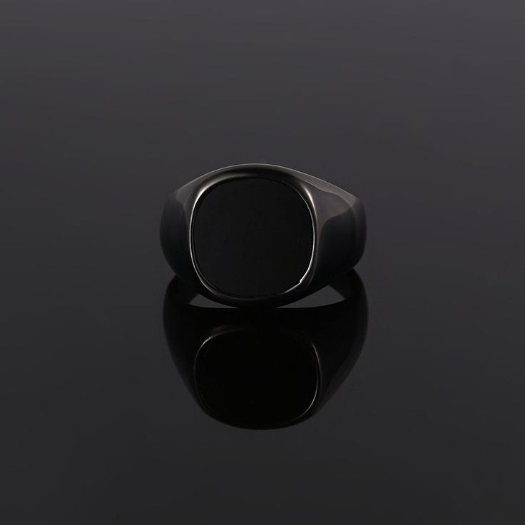 The Black Onyx Ring - Part of our new Blacked out collection. Created using real cuts of a black Onyx stone. Every stone is unique making it the perfect Ring for your unique style. This is our Latest Larger Signet Ring! Available in three different gemstones!  Available in Black / Silver / 18K Gold. Also available in Black Onyx (Real stone) & Green Opal (Lab Created) & Lapis Lazuli (Royal Blue) Unisex ring, womens sizes available.  DETAILS  Materials: Stainless Steel (Base) & 18K Gold PVD Platin Black Stainless Steel Rings For Gift, Classic Black Open Signet Ring, Black Stainless Steel Signet Promise Ring, Black Classic Open Signet Ring, Modern Black Enamel Signet Ring, Black Stainless Steel Ring Jewelry, Elegant Black Stainless Steel Rings, Modern Black Adjustable Rings, Modern Black Rings For Formal Occasions