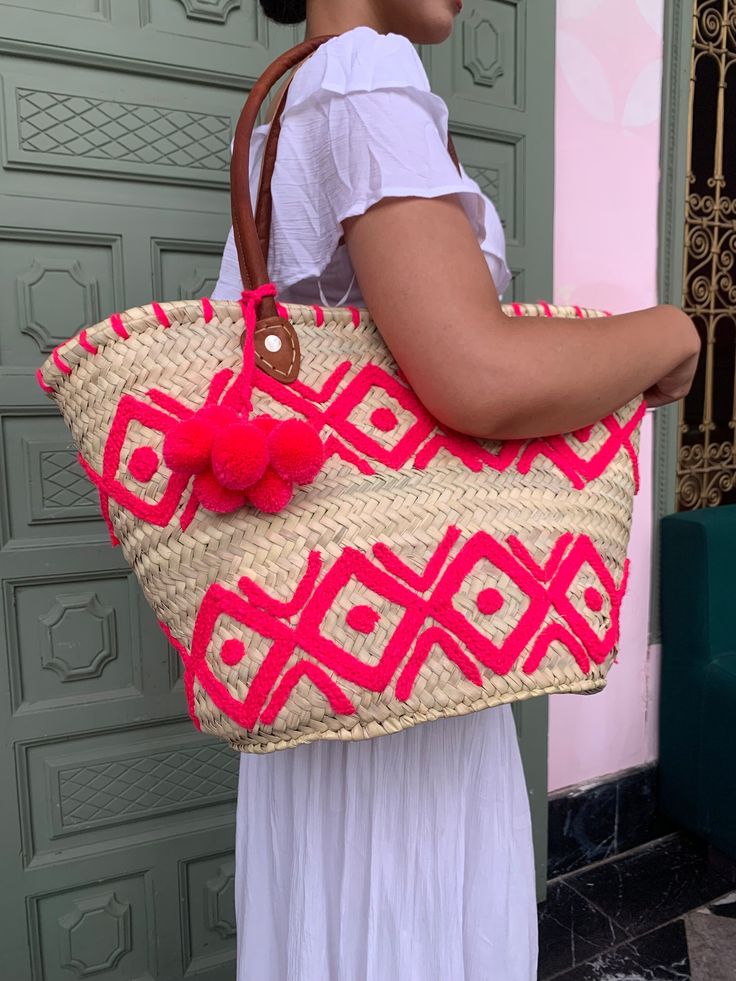 Please Check Our Straw Bags Unique Collection :  https://www.etsy.com/shop/BeLdiCountry?ref=seller-platform-mcnav§ion_id=34219098 A beautifully crafted basket to accompany you everywhere. It's a great basket for the beach or for shopping and will also make a great storage basket at home.  Each design is handmade and therefore completely unique. Approximate dimensions :  Length: 50 cm Height: 30 cm  Please note that as all our products are handmade, there may be slight variations in the dimensions of the baskets. Delivery is made worldwide by FEDEX Priority express and registered mail 3-5 Business days  For each shipment, a tracking number of your package will be sent to you immediately. You will find it in the tracking of your order on Etsy and will be able to follow your shipment at any t Handmade Red Bucket Bag For Summer, Red Handmade Bucket Bag For Beach, Pink Bucket Bag With Braided Handles In Tote Shape, Pink Bucket Bag With Braided Handles, Pink Tote Bucket Bag With Braided Handles, Bohemian Pink Bucket Bag For The Beach, Bohemian Pink Bucket Bag For Beach, Pink Bohemian Bucket Bag For The Beach, Summer Bohemian Pink Bucket Bag