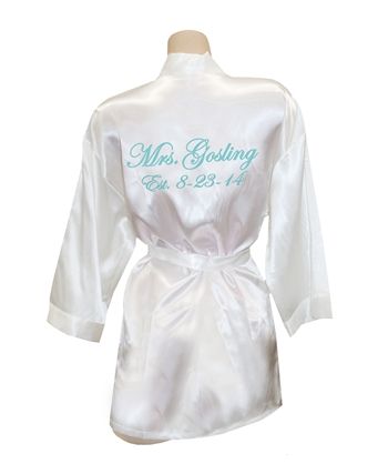 a white robe with the words mr and mrs written on it