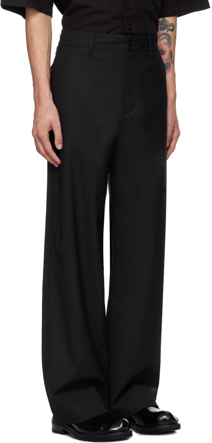 Loose-fit and wide-leg plain-woven stretch polyester- and wool-blend trousers. · Belt loops · Four-pocket styling · Zip-fly Supplier color: Black Tailored Black Pants With Side Pockets, Formal Black Pants With Side Pockets, Black Wide Leg Pants With Pockets And Straight Hem, Black Business Bottoms With Side Pockets, Black Tailored Wide Leg Pants With Straight Hem, Tailored Black Wide Leg Pants With Straight Hem, Black Wide Leg Workwear Pants With Straight Hem, Black Wide Leg Pants For Work With Straight Hem, Black Wide Leg Pants With Welt Pockets